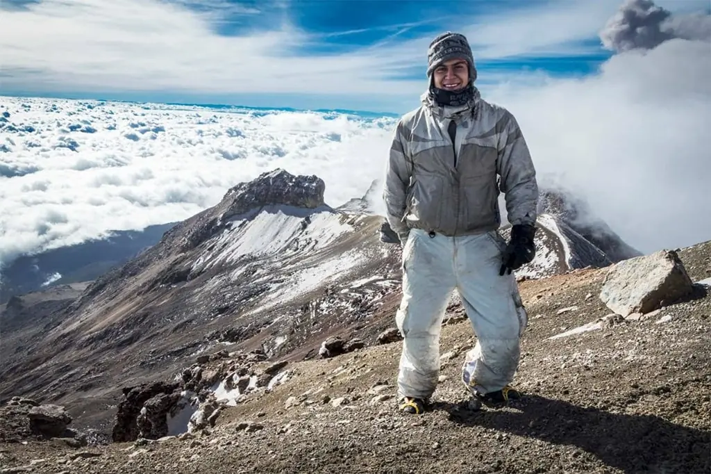 Hiker on Iztaccíhuatl with Popocatépetl behind